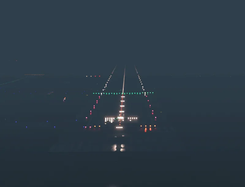 Runway approach lights glowing through fog at night